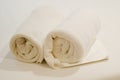 Two roll of white towel on bed Royalty Free Stock Photo