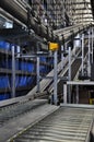 Two roller conveyors in an automated warehouse.