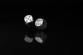 Two Rolling SilverCasino Dice on Black Background Royalty Free Stock Photo