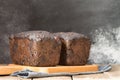 Two rolls of homemade sweet dessert bread with malt, prunes, walnuts, flour leaven, long fermentation