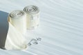 Two rolls of medical cotton elastic bandage, with fastening, deployed on a light background. Space for text Royalty Free Stock Photo
