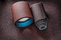 Two rolls of sandpaper on abrasive sheet Royalty Free Stock Photo