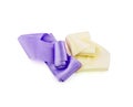 Two rolls of Satin ribbon of violet and pale yellow color Royalty Free Stock Photo