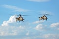 Two Rooivalk attack helicopters flying