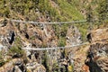 Two rope hanging suspension bridges in Nepal Himalayas under Namche Bazar above Dudh Koshi Nadi river, Mount Everest base camp
