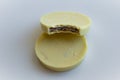Two round cookies enrobed with white chocolate Royalty Free Stock Photo