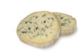 Two round piece of blue cheese (Fourme d'Ambert) isolated on white background Royalty Free Stock Photo
