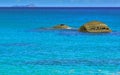 Two round rocks in the turquoise colored waters of the seychelles Royalty Free Stock Photo