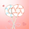 Two round striped pastel pink and blue color lollipops with decorative ribbon and blurred hearts. Couple candies on
