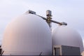 Two round toped white grain silos in the Foulon Cove port area seen from the Champlain Boulevard during sunrise Royalty Free Stock Photo