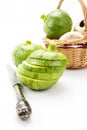 Two round zucchini cut in slices and wicker basket with vegetables Royalty Free Stock Photo