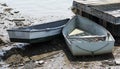Two row boats stuck on the mud during low tide in Maine USA Royalty Free Stock Photo