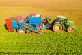 Two row Carrot Picker processing rows of ripe Carrots. Royalty Free Stock Photo