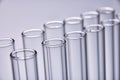 Row of empty test tubes gray background Royalty Free Stock Photo