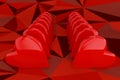 Two rows of red hearts on a low poly red background