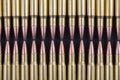 Two rows of rifle rounds touching Royalty Free Stock Photo