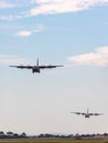 Two Royal Australian Air Force Lockheed Martin C-130J Hercules military cargo aircraft performing a tactical approach to Avalon Ai