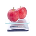 Two Royal Gala Apples on a Scale Royalty Free Stock Photo