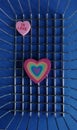 Two rubber isolated hearts on mettalic shopping basket