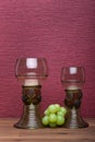 Two rummer wine glass with green grapes Royalty Free Stock Photo