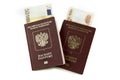Two Russian passports with banknotes five thousand rubles and euros on a white background. Traveling abroad to Europe, tour Royalty Free Stock Photo