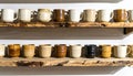 Rustic Ceramic Mugs Displayed on Reclaimed Wood Shelves Against White Wall Royalty Free Stock Photo