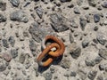 Two rusty chain links on stones Royalty Free Stock Photo