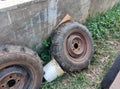 two rusty old black tires