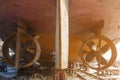 Two rusty screws in the nozzle belonging to the ship, which stands in a dry dock in winter Royalty Free Stock Photo