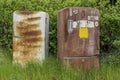 Two rusty fridges abandoned outside on the prairies