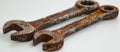 Two Rusty Wrenches on White Surface