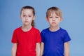 Two sad child little girl and boy dressed in T-shirt, Royalty Free Stock Photo