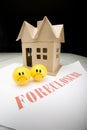 Two Sad Faces with Foreclosing House Royalty Free Stock Photo