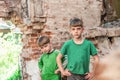 Two sad and unhappy brothers in a destroyed and abandoned buildi Royalty Free Stock Photo