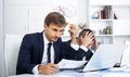 Two sad young men coworkers in firm office Royalty Free Stock Photo