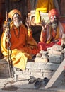 Two sadhus seeking alms in Pashupatinath, Nepal