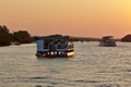 Two safari ships cruising Zambezi river. Royalty Free Stock Photo