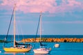 Two sail boats docked at Mackinac Island during a bright red sunset Royalty Free Stock Photo