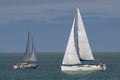 Two sailboats on the open sea