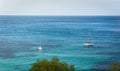 Two Sailing boat on blue mediterranean water in Ibiza island Royalty Free Stock Photo