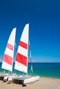 Two sailing catamarans on the beach in Kemer, Turkey Royalty Free Stock Photo