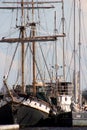 Two sailing ships are moored to each other at the pier Royalty Free Stock Photo