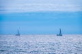 Two Sailing yachts in the blue calm sea Royalty Free Stock Photo