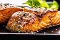 Two salmon fillets baked until crispy with sesame - Close up