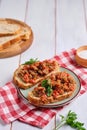 Two sandwiches with eggplant caviar made from baked eggplants, sweet peppers and tomatoes, seasoned with vegetable oil, on a green Royalty Free Stock Photo