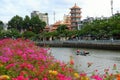 Two sanitation worker on boat move on canal at Ho chi Minh city