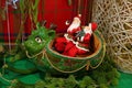 Two Santa Claus Riding Green Reindeer Shaped Sleigh, a Unique Christmas Home Decoration Royalty Free Stock Photo