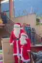 two santa claus standing ready for the event Royalty Free Stock Photo
