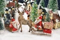 Two Santa Clauses and reindeer came to a small town on sledge with Christmas presents Royalty Free Stock Photo