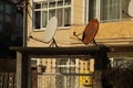 Two satellite dish one is rusted and broken Royalty Free Stock Photo